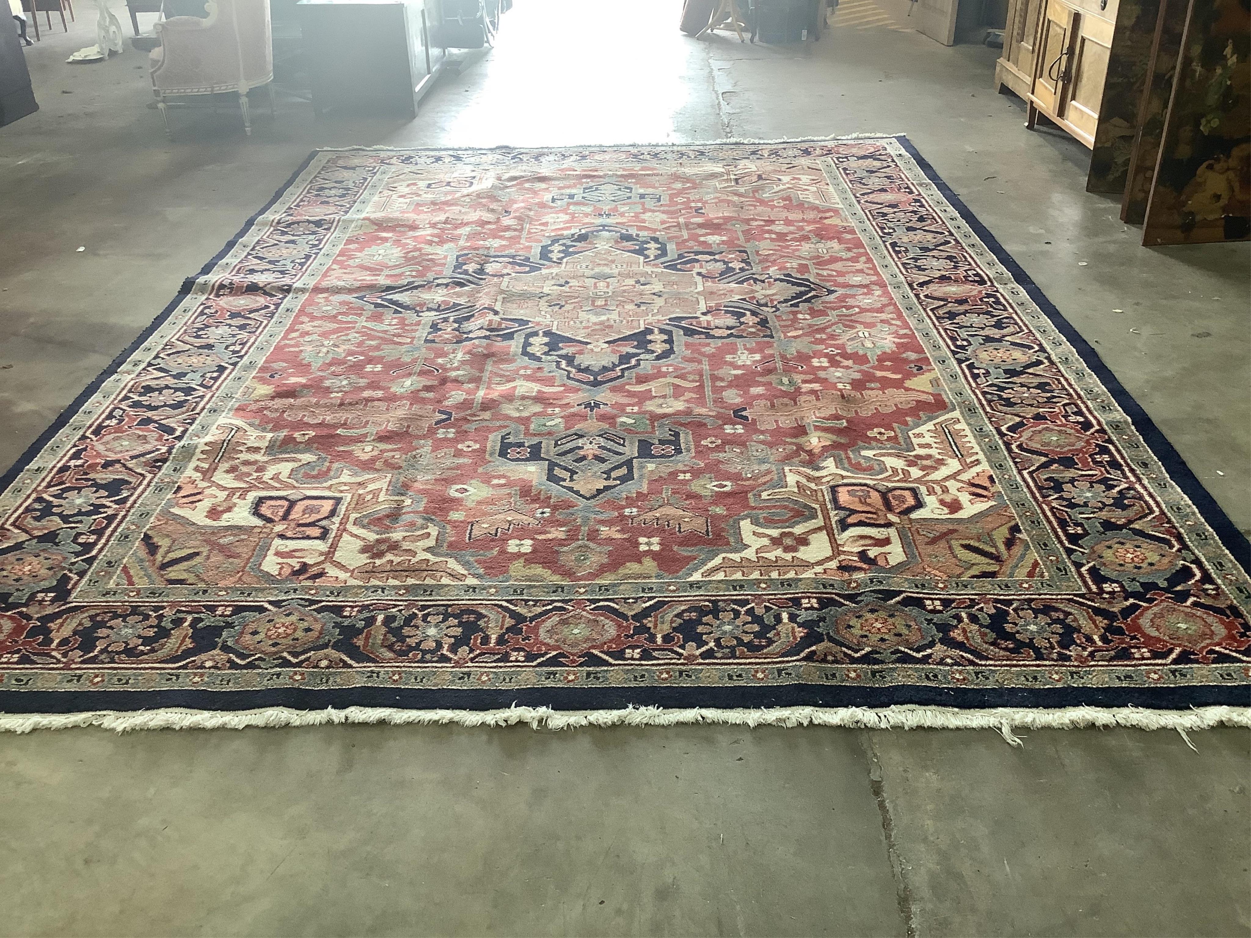 An Indo Persian Heriz carpet, 430 x 300cm. Condition - good